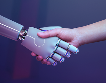 serrage de mains entre robot et humain intelligence artificielle